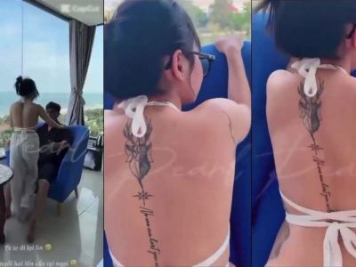 Phang em gái đeo kính bên khung cửa sổ